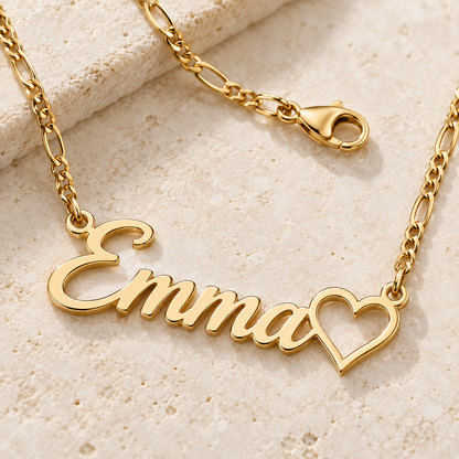Close-up of a gold custom name necklace chain, connectors and lobster clasp
