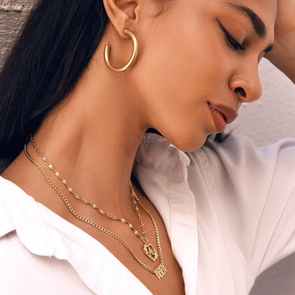 Woman Wearing Flower Initial Necklace
